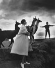 Model with llamas, Peru, 1952 by Antoinette Frissell